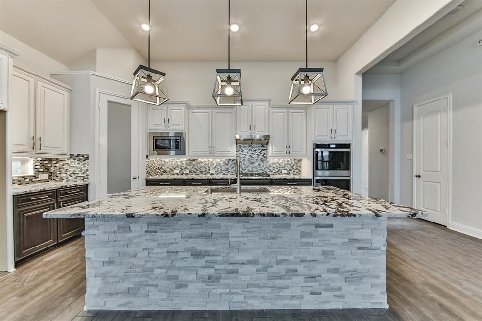 Designer Kitchen !  Pendant lighting and huge island with breakfast bar