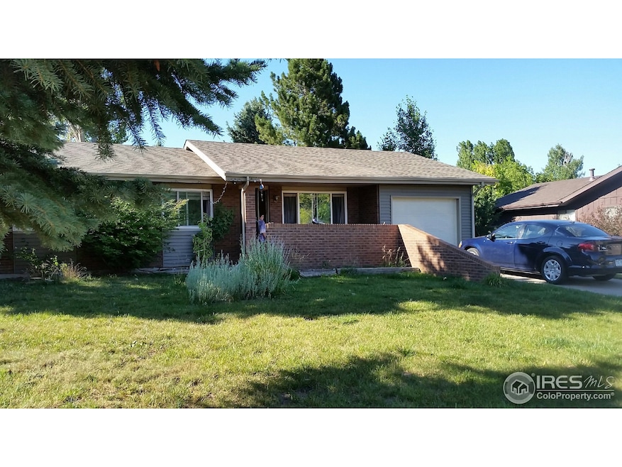 Front, patio behind wall