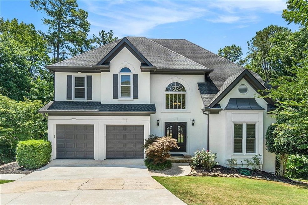 View of front of property with a garage