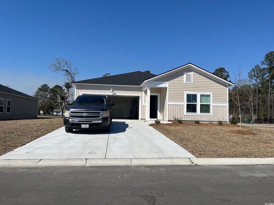 View of front of property featuring driveway, boar