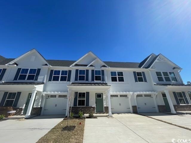 Townhome / multi-family property with a garage, br