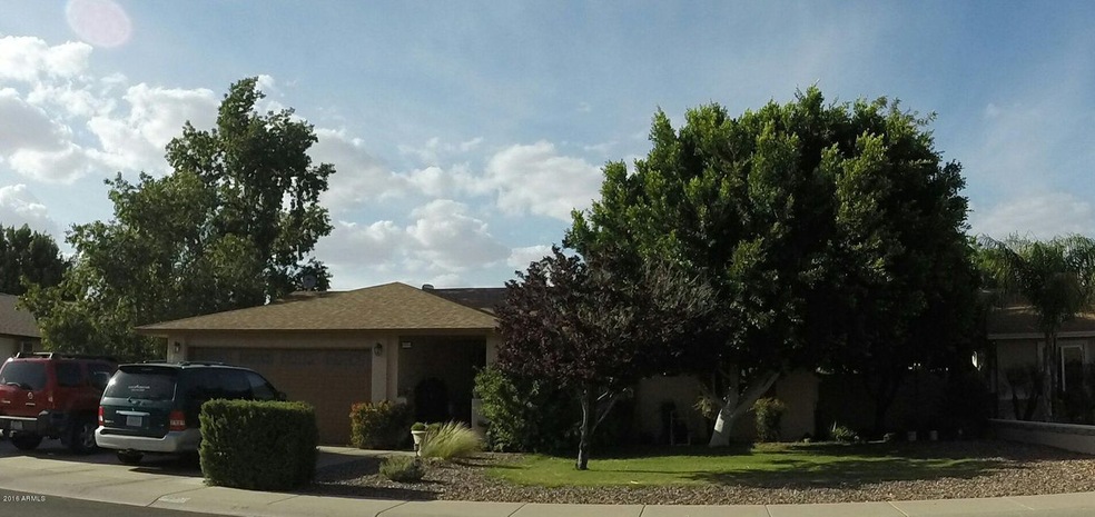 Front view with beautiful mature trees