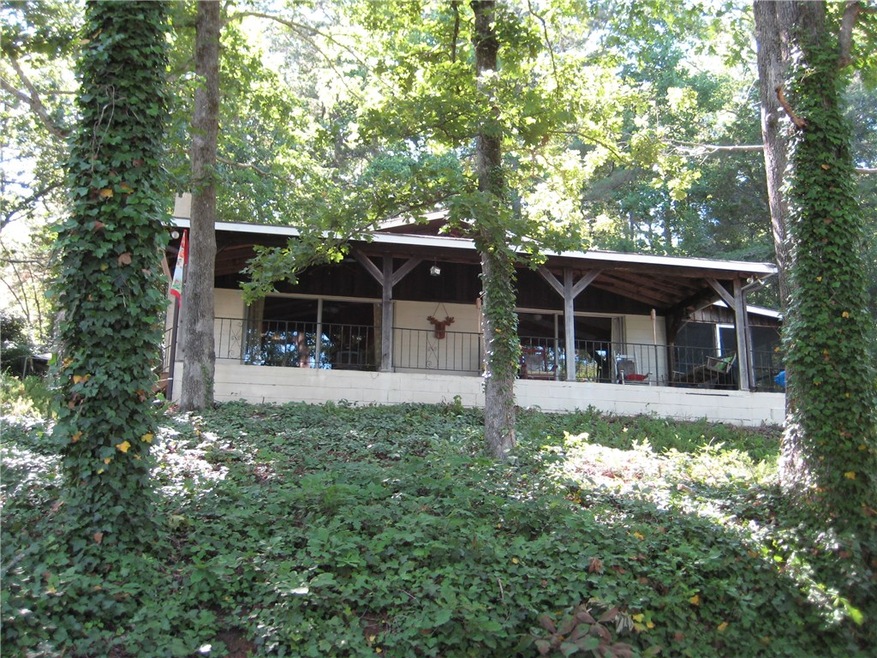 Front porch faces lake with big water view