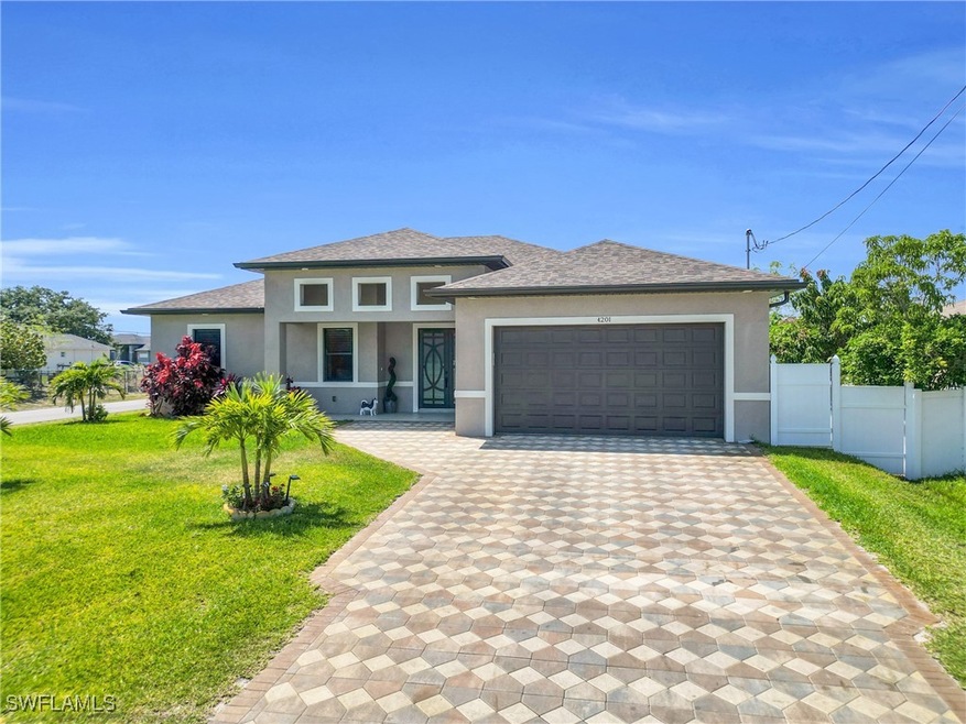 Prairie-style home featuring decorative driveway,