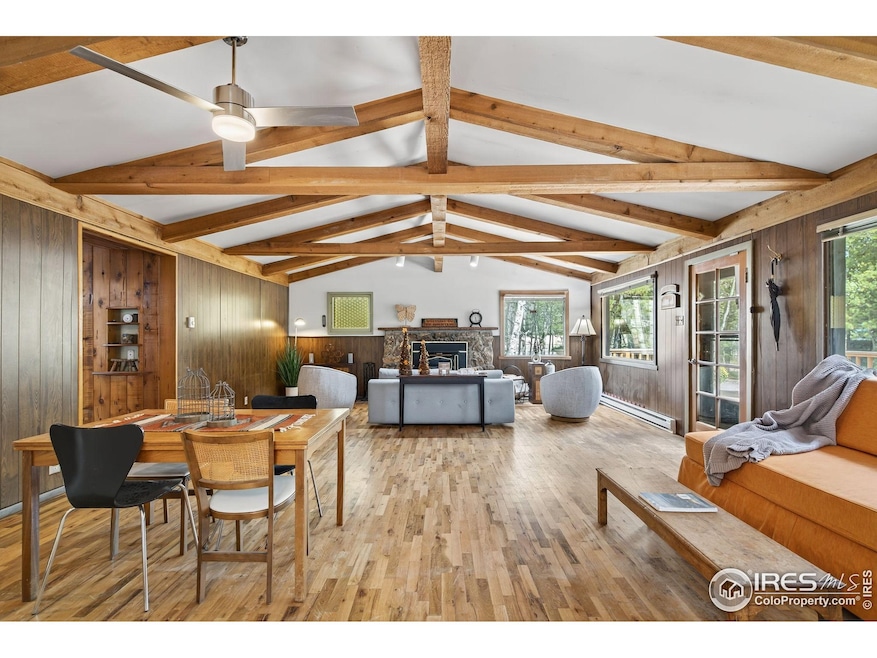 Open floor plan with wood beams