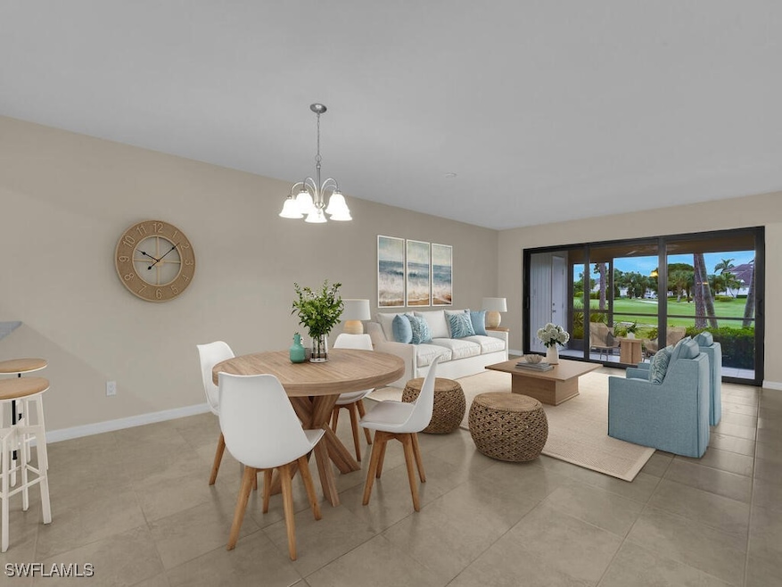 Dining space featuring baseboards, light tile patt