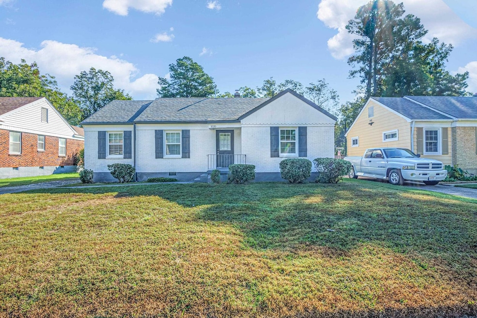 Single story home featuring brick siding and a fro