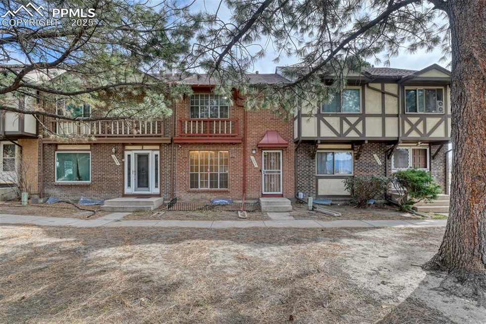 Multi unit property with entry steps, brick siding, and stucco siding