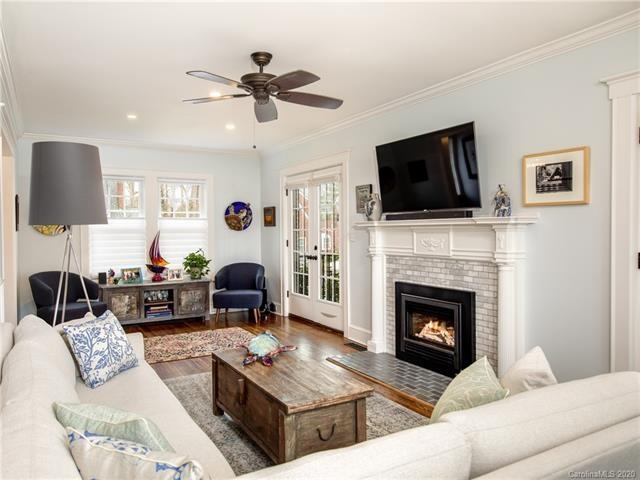 Living room with gas FP and french doors leading to covered porch