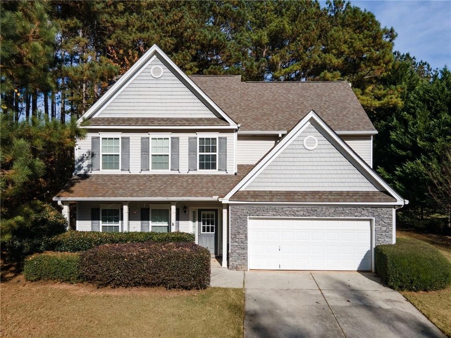 View of front facade featuring a garage