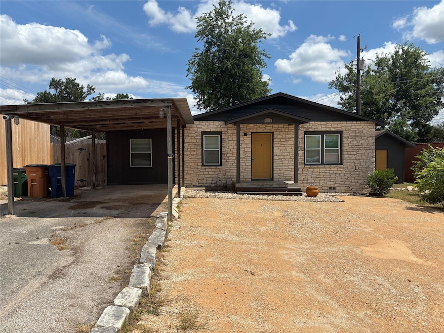View of front facade featuring asphalt driveway, 