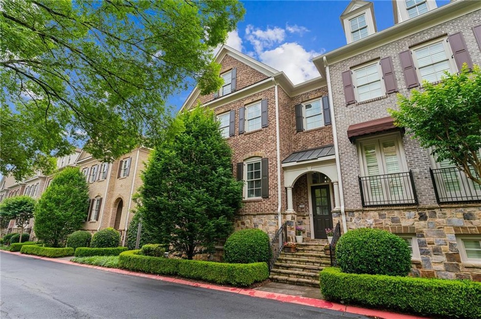 Gorgeous Hug End Unit Townhome Featuring Brick and Stone Siding!