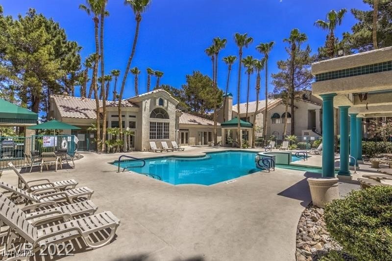 Community pool featuring a patio area
