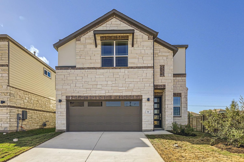 View of front of property featuring an attached g