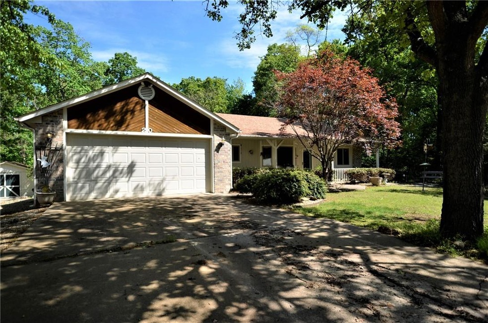 Wonderful landscaping surrounds this single level home. Both the front and back yards are level as well.