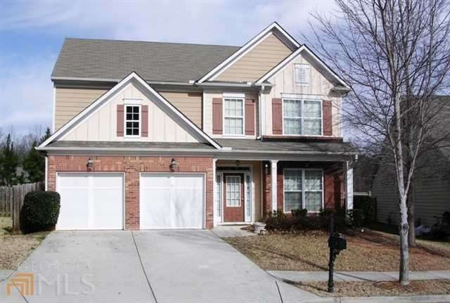 Brick and cement siding front of the house.