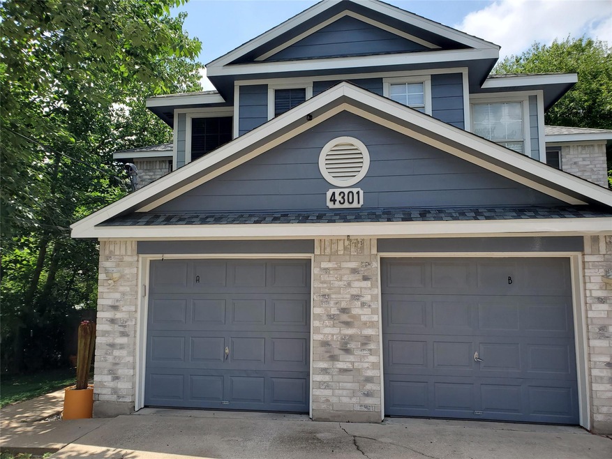 View of front of property featuring concrete driv
