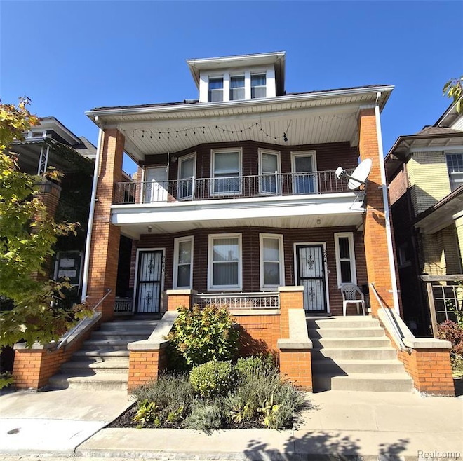 Traditional style home with brick siding and a porch