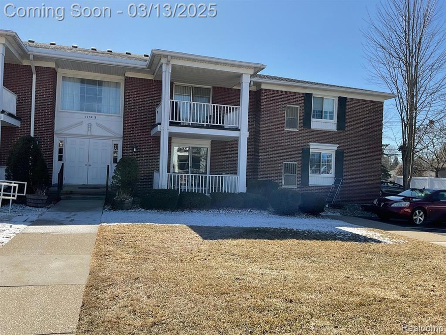 Condominium building (bk entry door) unit on right