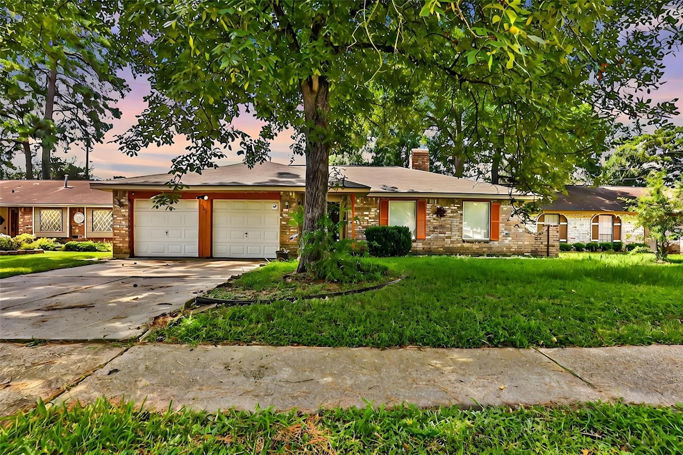 This charming single-story brick home features a t