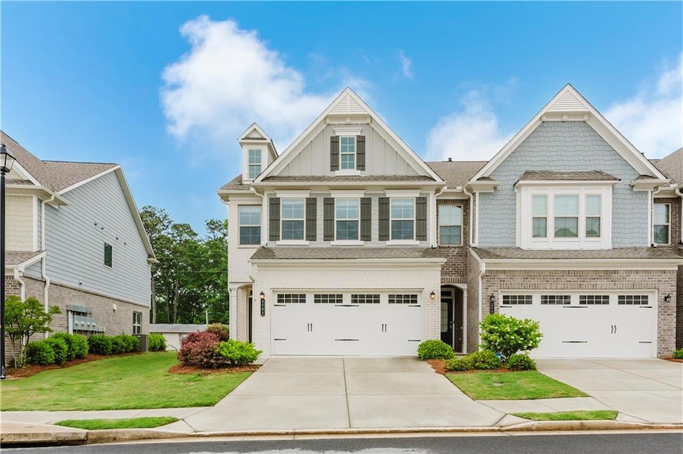 View of front of property featuring driveway, an a