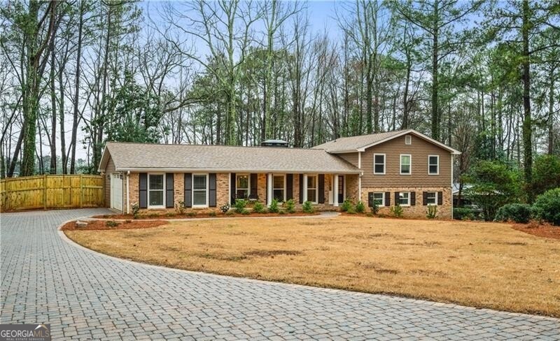 Great curb appeal with handsome paver drive and wa