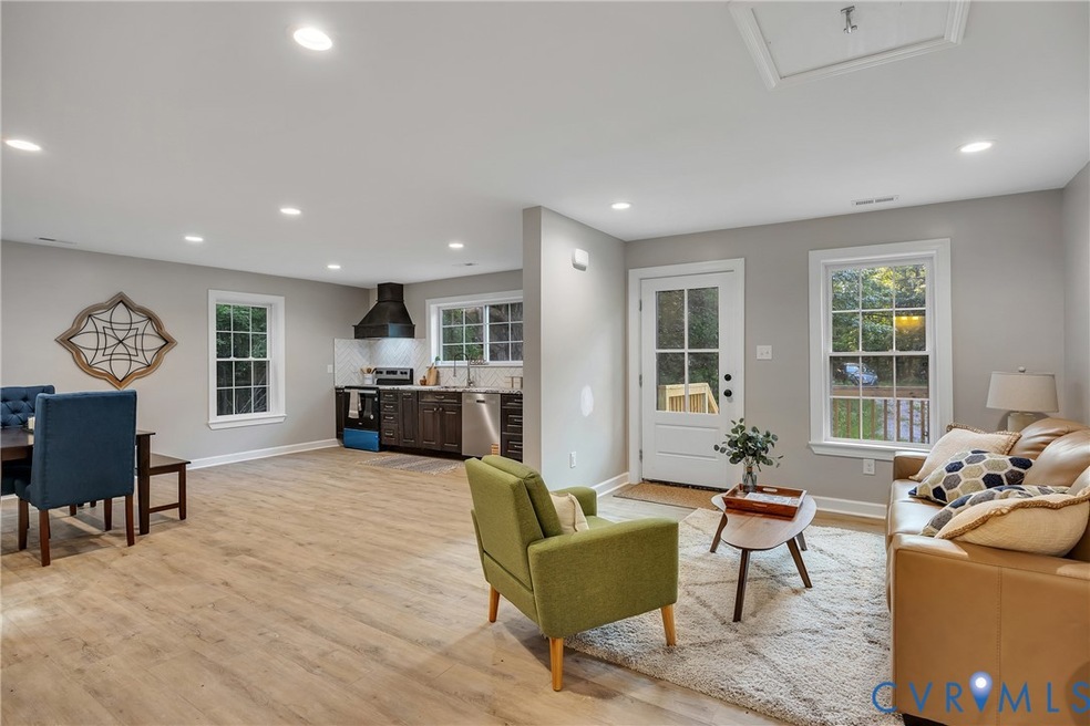 Living area featuring healthy amount of natural light, recessed lighting, and light wood-type flooring