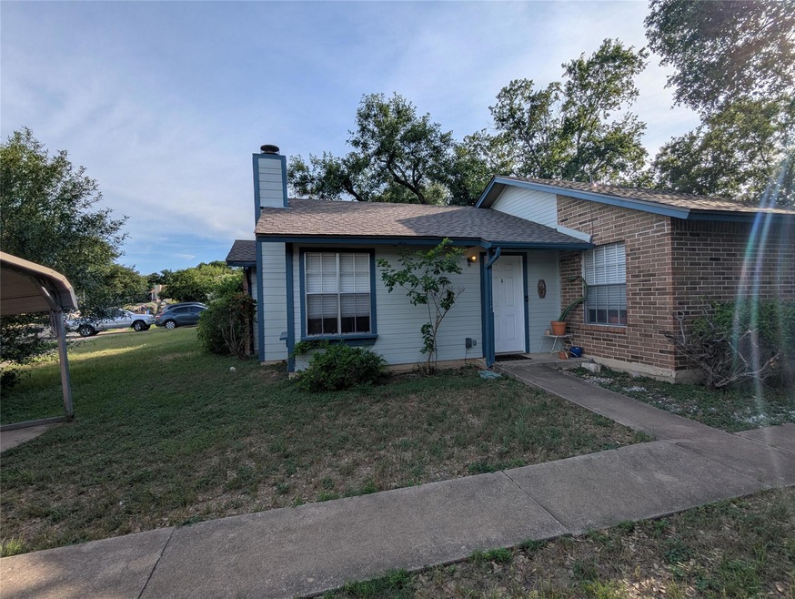 View of front of property with a front lawn, a ch