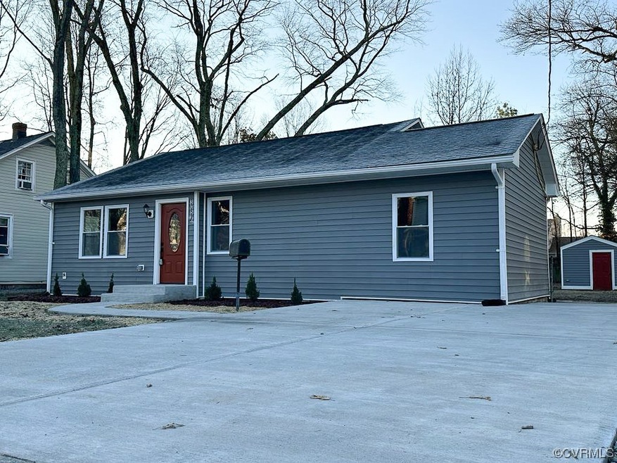 View of front of home featuring a shed and a patio