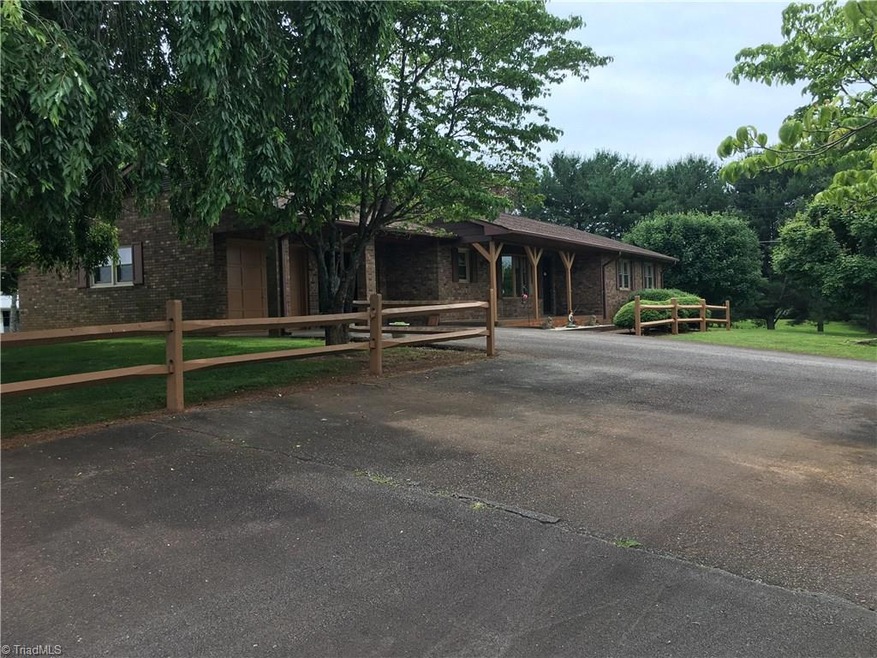 Main home offers a turn around area that joins the cottage driveway.