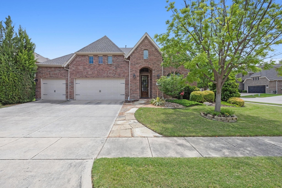 View of front of property with a garage and a fron
