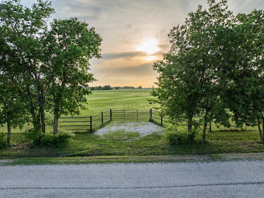 View of nearby features with a lawn and a rural view