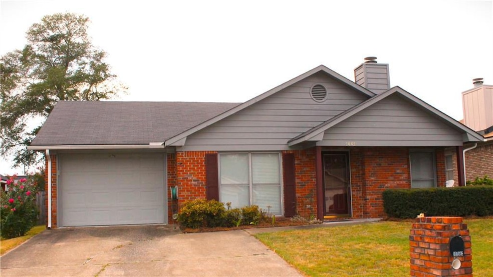 View of front of property featuring a garage and a