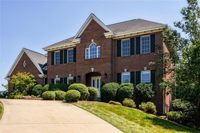 Welcome to this magnificent all-brick custom-built