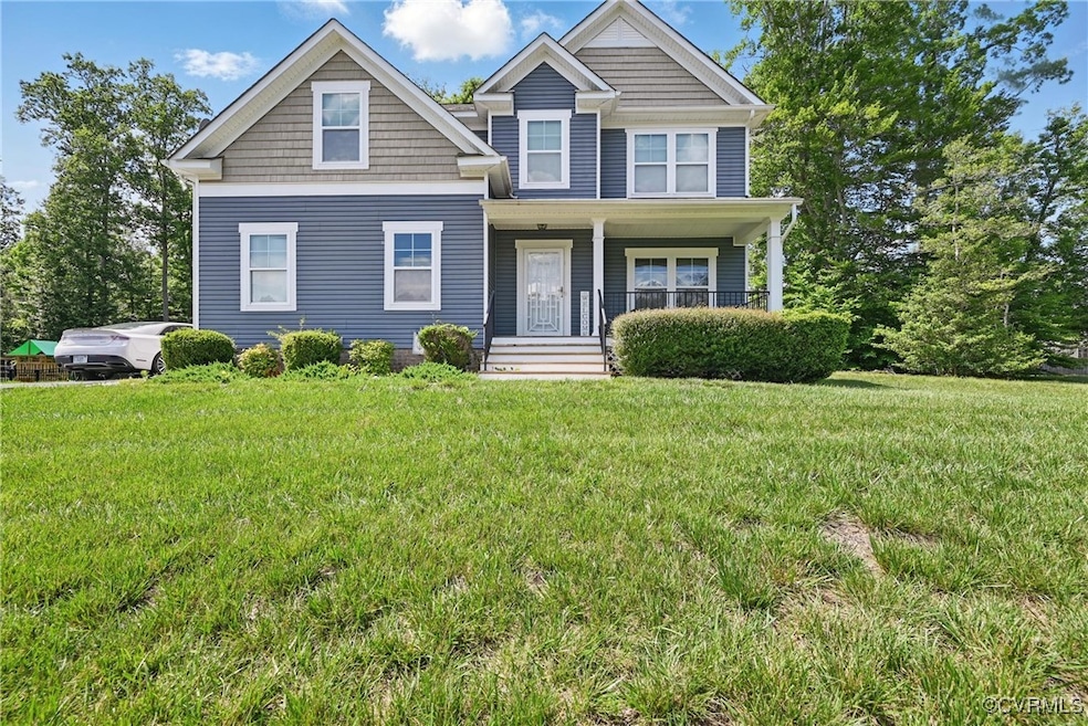 View of front of property with covered porch and a