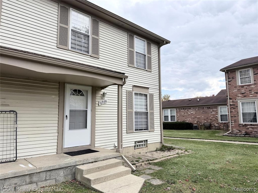 Entrance to property featuring a lawn