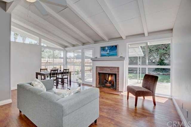 High ceilings and walls of glass make the living r