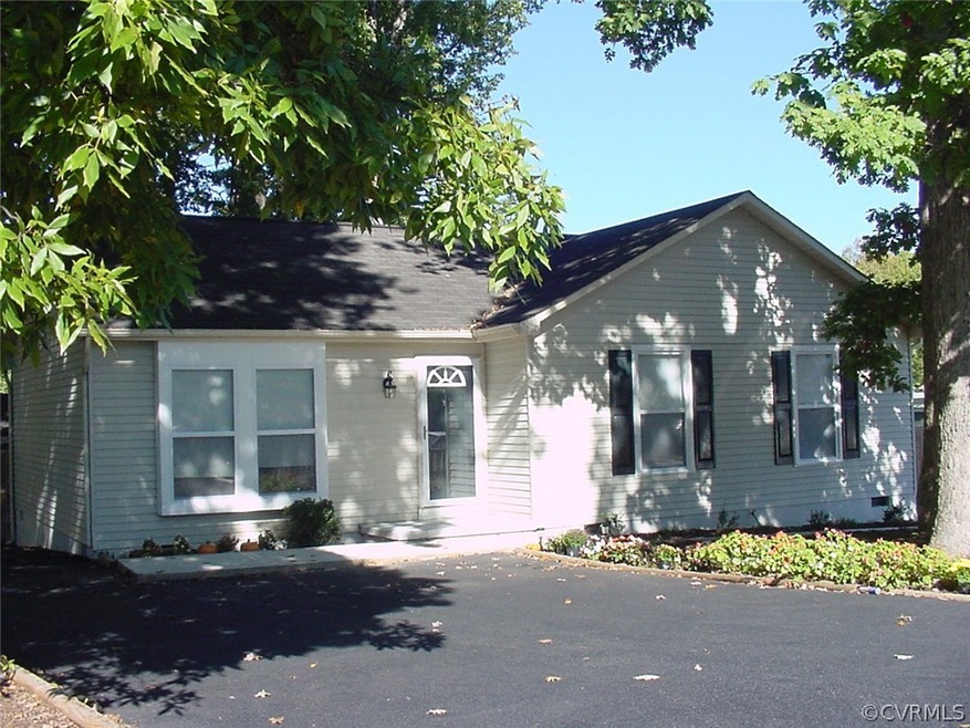 Front view & double width paved driveway. Just one