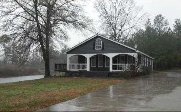 Exterior Front. Picturesque setting with 4+ acres 