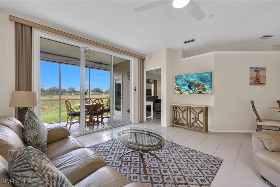 Living area featuring light tile patterned floors