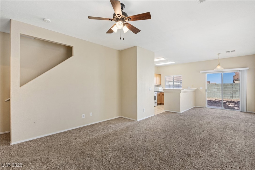 Unfurnished living room featuring baseboards, ceil