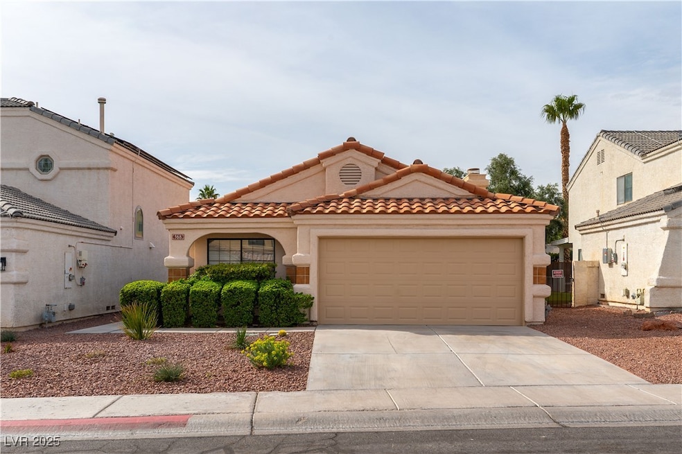 Exterior front with a 2 car garage.
