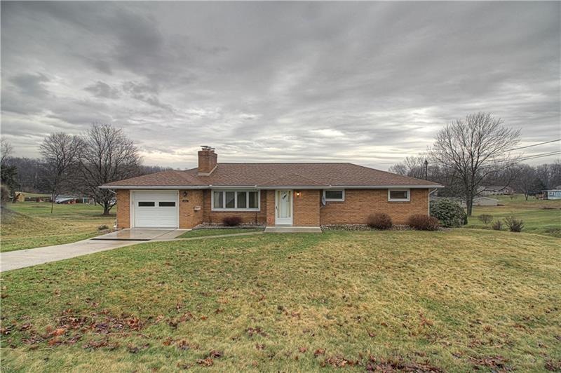 Welcome to 133 Wall Street, a 4-BR brick ranch sit