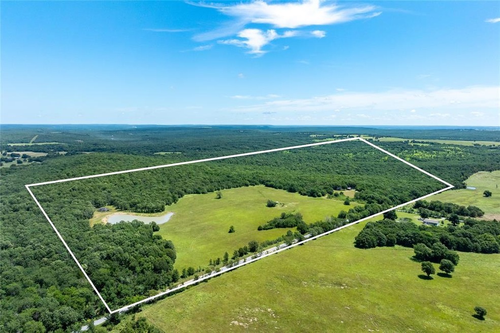 Aerial view of sparsely populated area with property boundaries highlighted