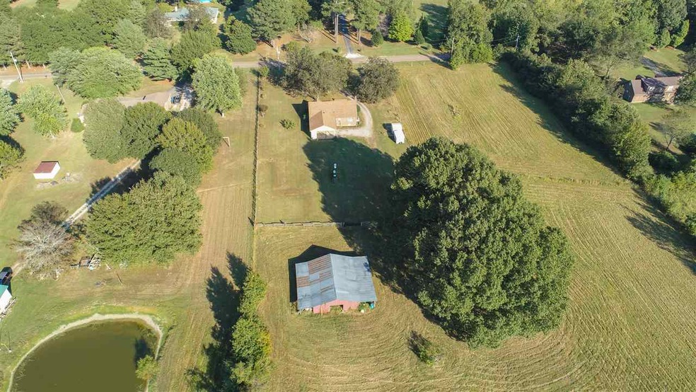 Situated on 5.53 beautiful acres, this 3-bedroom, 