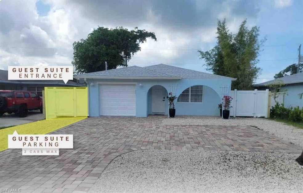 Single story home featuring a garage, stucco sidin