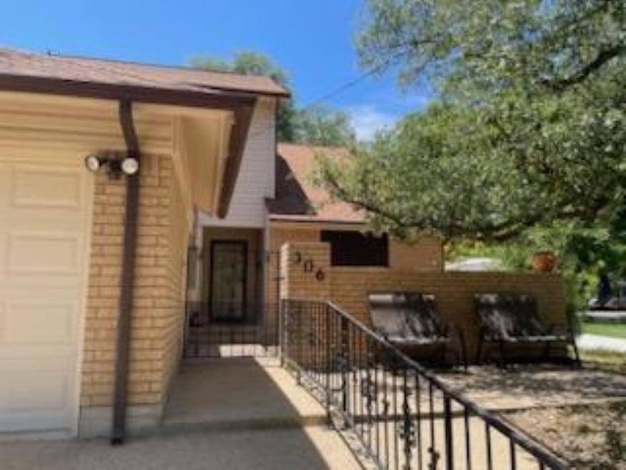 Doorway to property featuring a garage