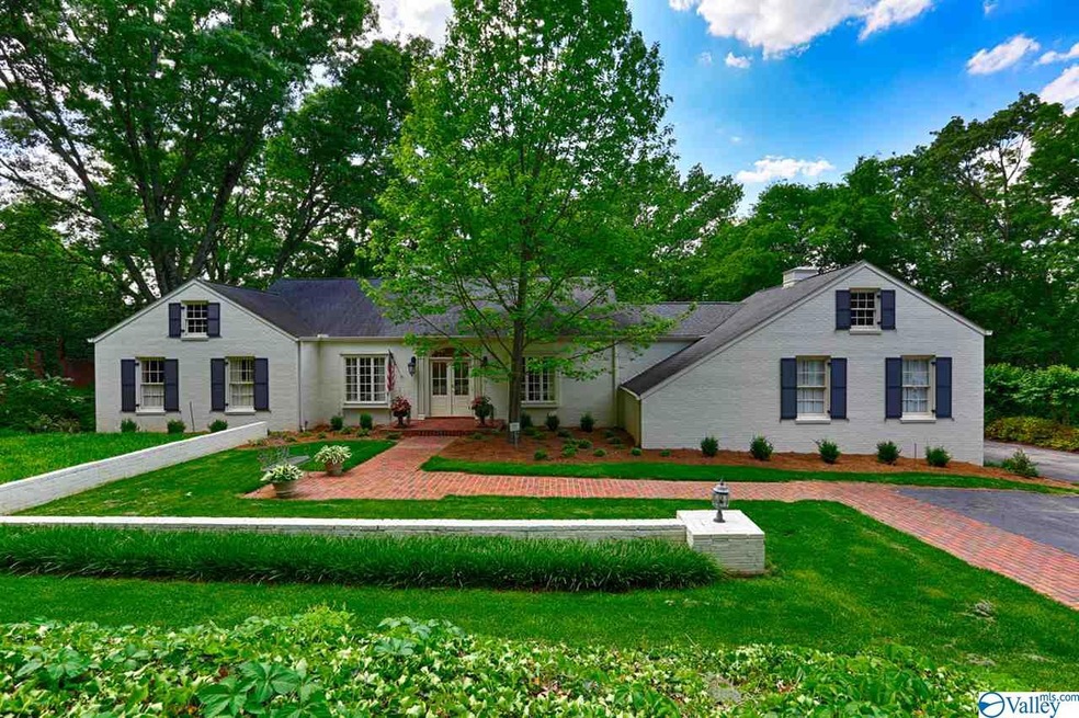 A french flair can be found in this sprawling basement rancher with painted brick, large windows, hinged shutters and elegant outdoor terraces. Private lot with diverse and beautiful landscaping.