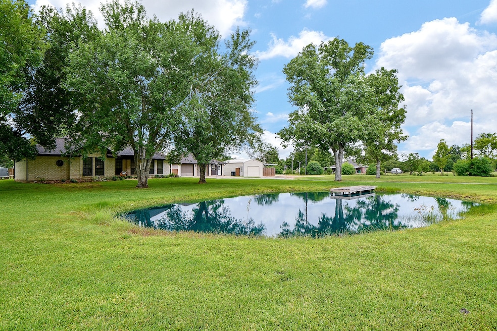 Beautiful home with picture perfect pond with pier