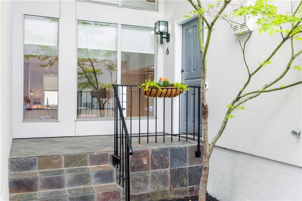 A private entry & front balcony with towering wind